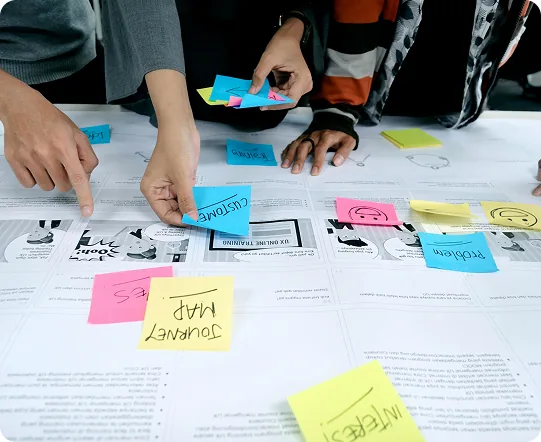 Design and engineering team collaborating around a desk